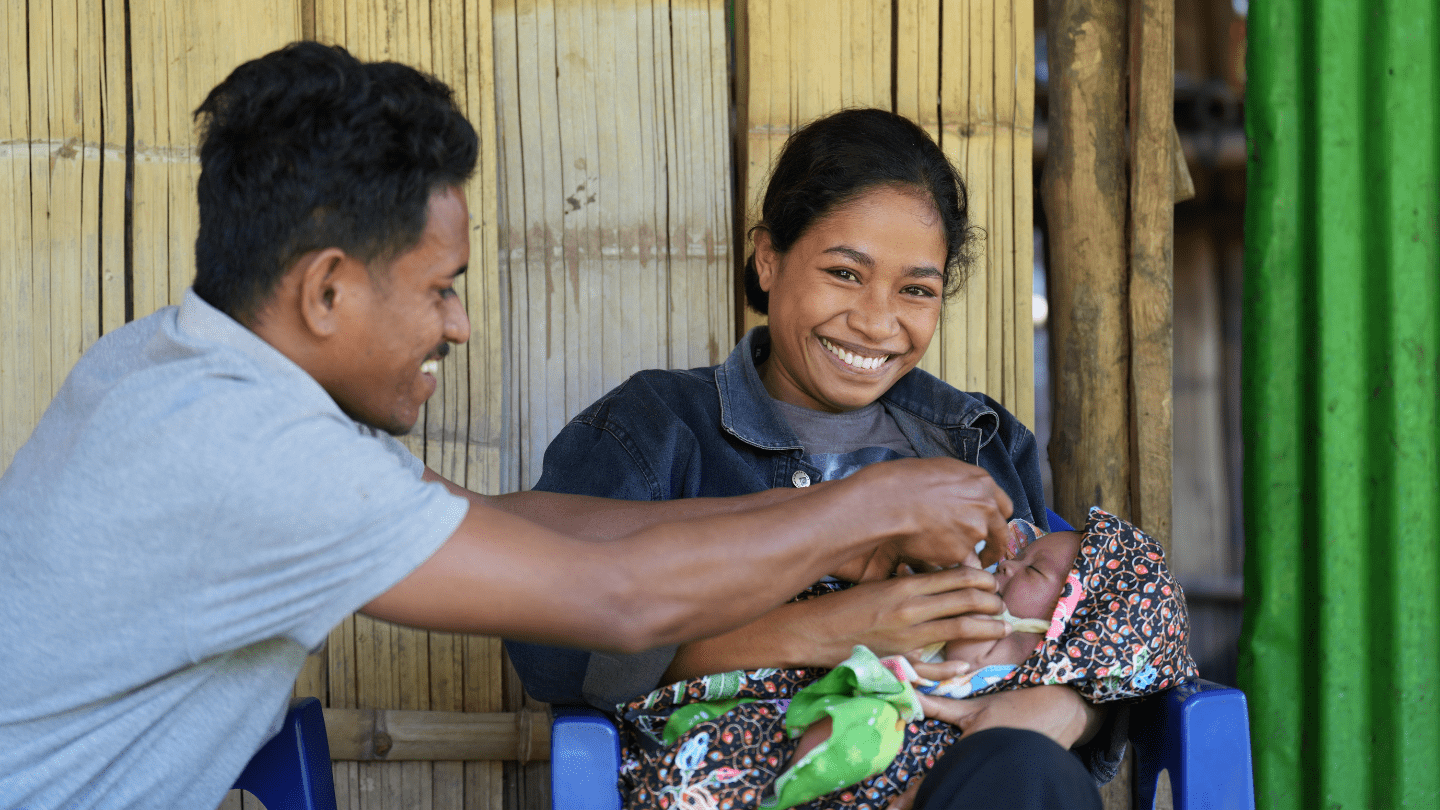 Ms. Oliviana Viera and her husband, Bonjono da Costa, share a joyful smile after their successful delivery at the BEmONC center. 